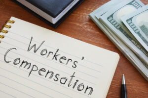 Notebook with the word "Workers' Compensation" written - Schultz & Myers Personal Injury Lawyers in St. Louis near you
